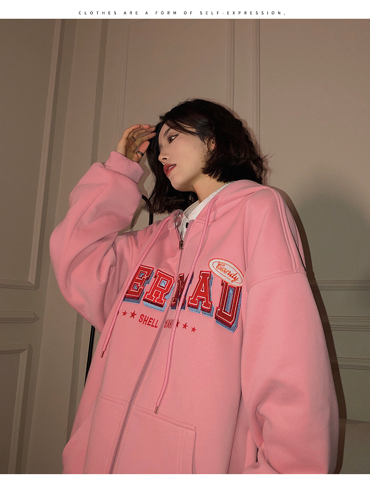 A woman wearing a cardigan with a hood on both sides in a loose pink, niche design with a checkered pattern is particularly stylish pic 21