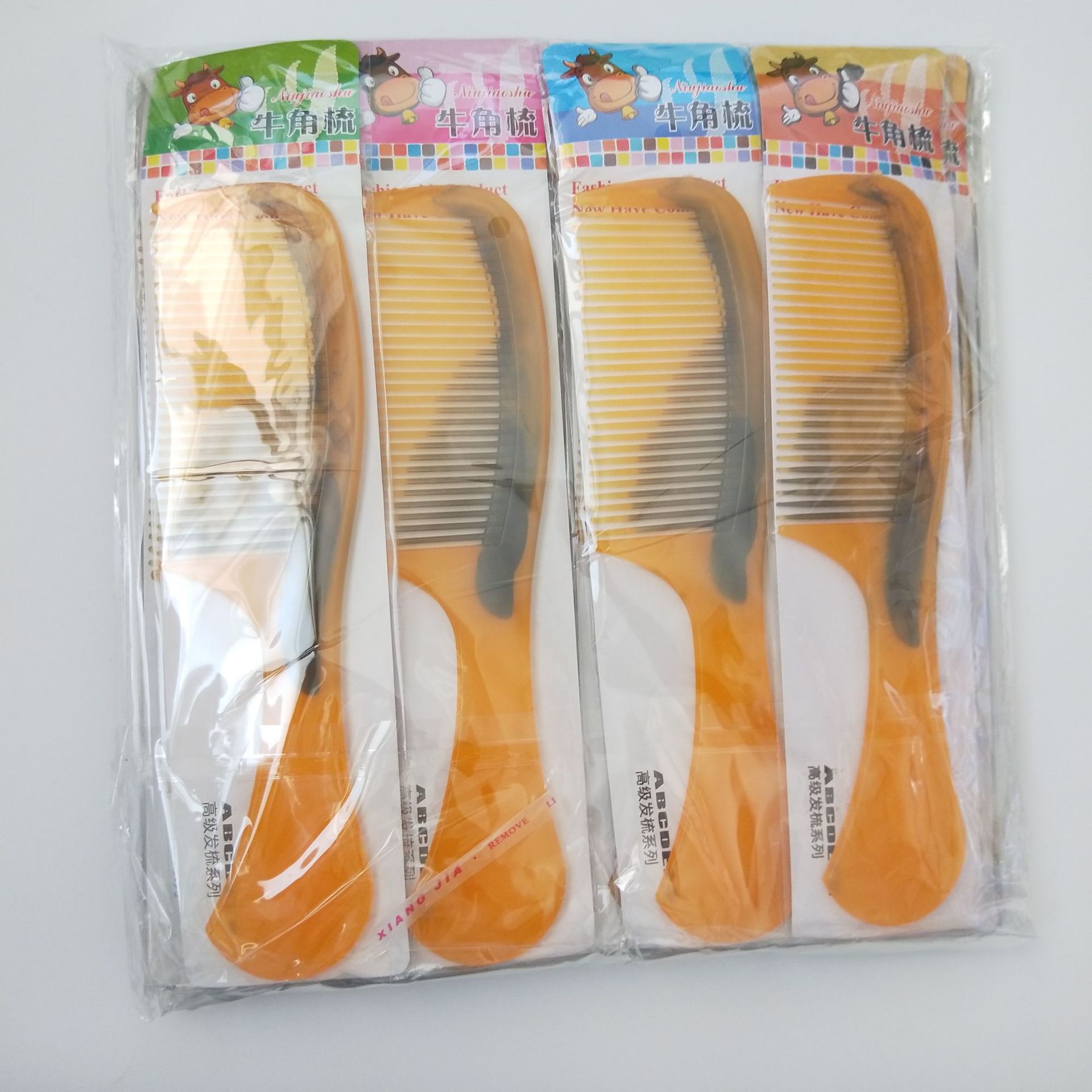 Imitation ox tendon beauty comb, mixed color hair comb, yellow plastic comb, 1 yuan or 2 yuan wholesale supply pic 1
