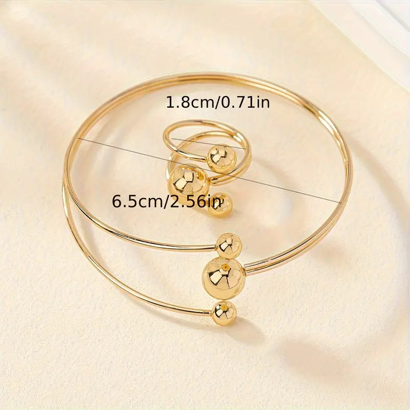 A simple, fashionable and personalized wrist and finger accessory set of gold and silver small balls with large balls in layers pic 9