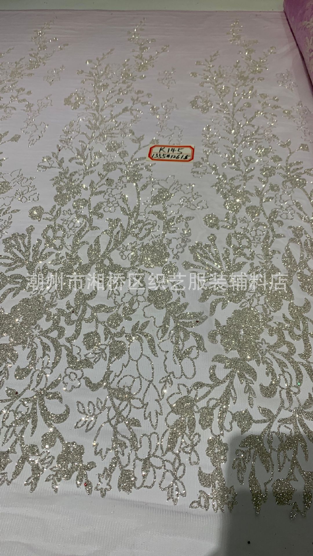 K145 patterned wedding dress fabric in stock, featuring a mesh fabric with gold sheets and gold spray patterns pic 16