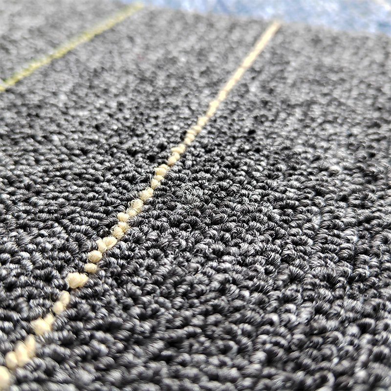 The carpet is fully covered with square blocks pic 2