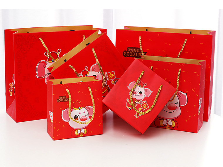 Factory direct sales of cute cartoon Year of the Pig hand-held packaging bags, gift bags, paper bags, return gift bags, customized pic 13