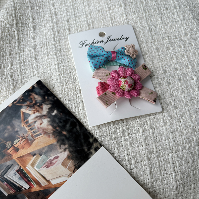 韩版卡装边夹蕾丝布艺蝴蝶结发夹少女儿童发饰可爱波点发夹刘海夹详情5