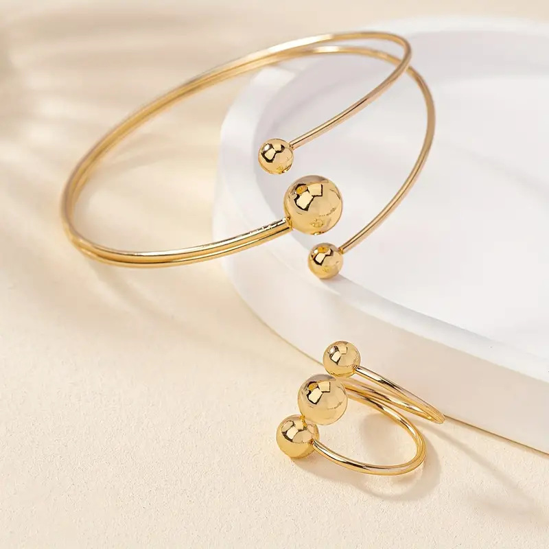 A simple, fashionable and personalized wrist and finger accessory set of gold and silver small balls with large balls in layers pic 6