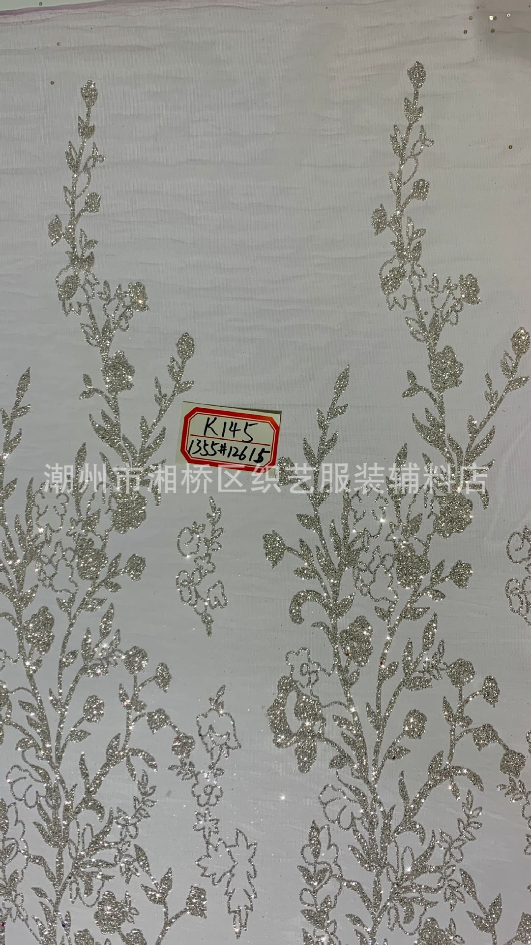 K145 patterned wedding dress fabric in stock, featuring a mesh fabric with gold sheets and gold spray patterns pic 14