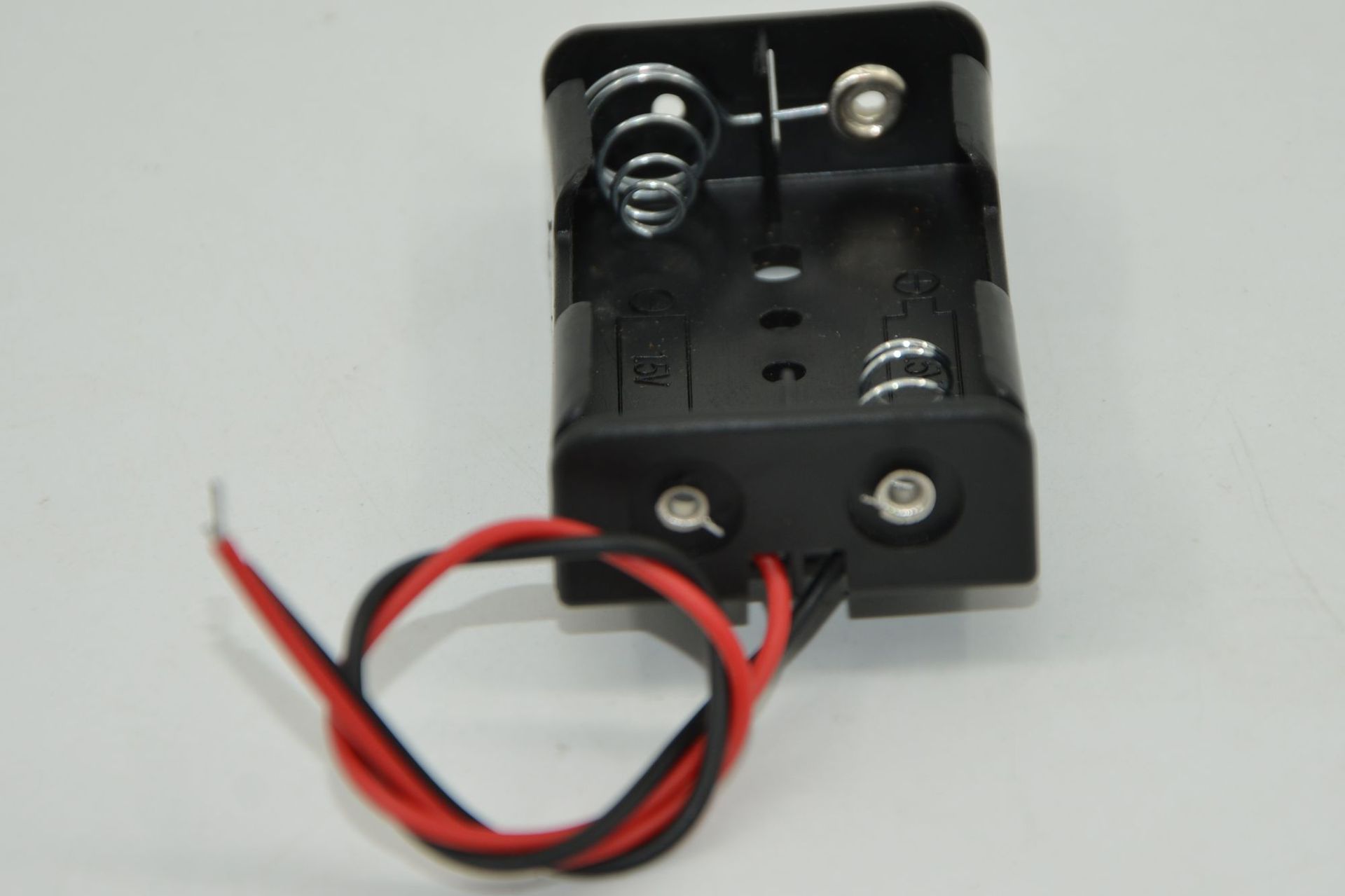 Two AA battery boxes, uncovered with wires, black power supply, positive and negative DC power supply, student experiment science physics pic 4