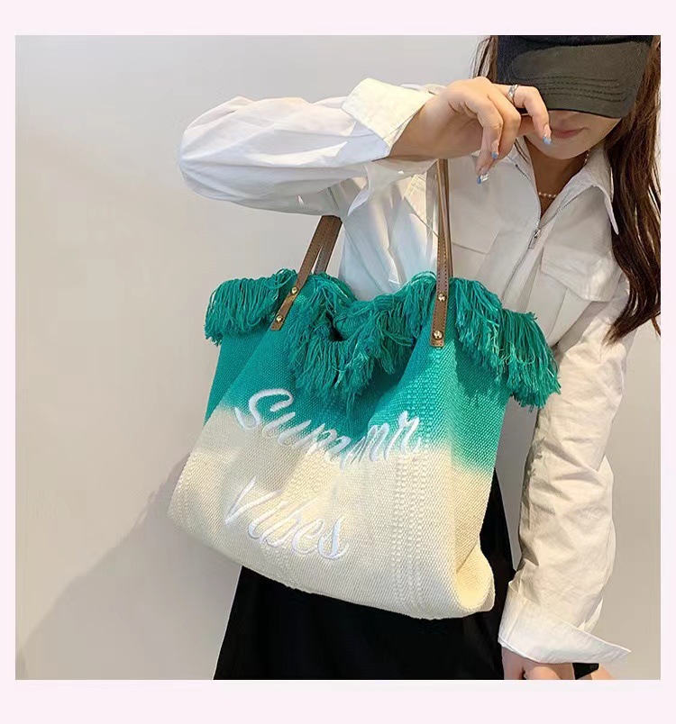韩版春夏新款女包大容量帆布渐变编织流苏刺绣简约通勤百搭托特包详情9