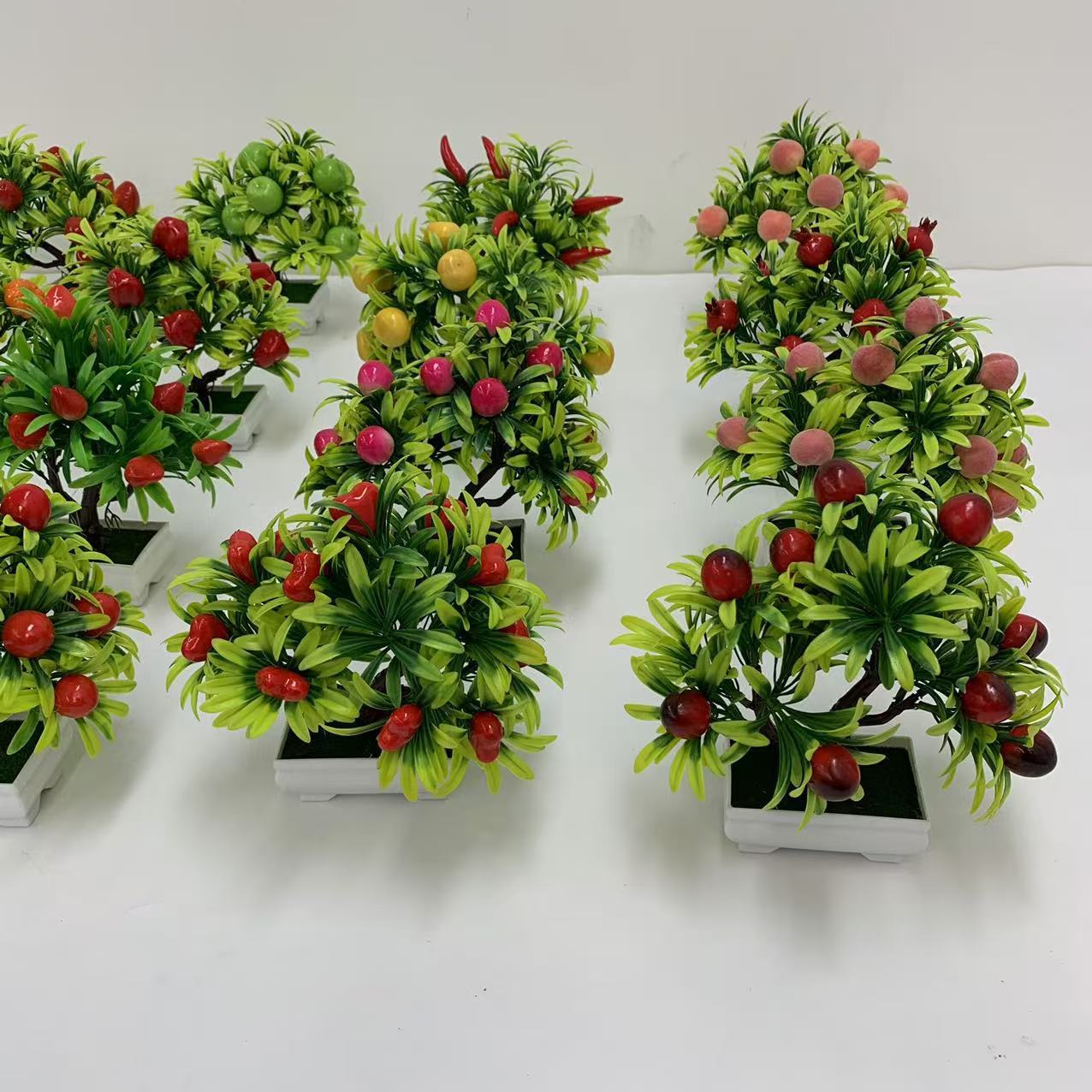 A comprehensive collection of simulated fruit potted plants and bonsai, including red apples, pomegranates, strawberries, oranges, peaches, mangoes, bananas, and red peppers for decoration pic 23