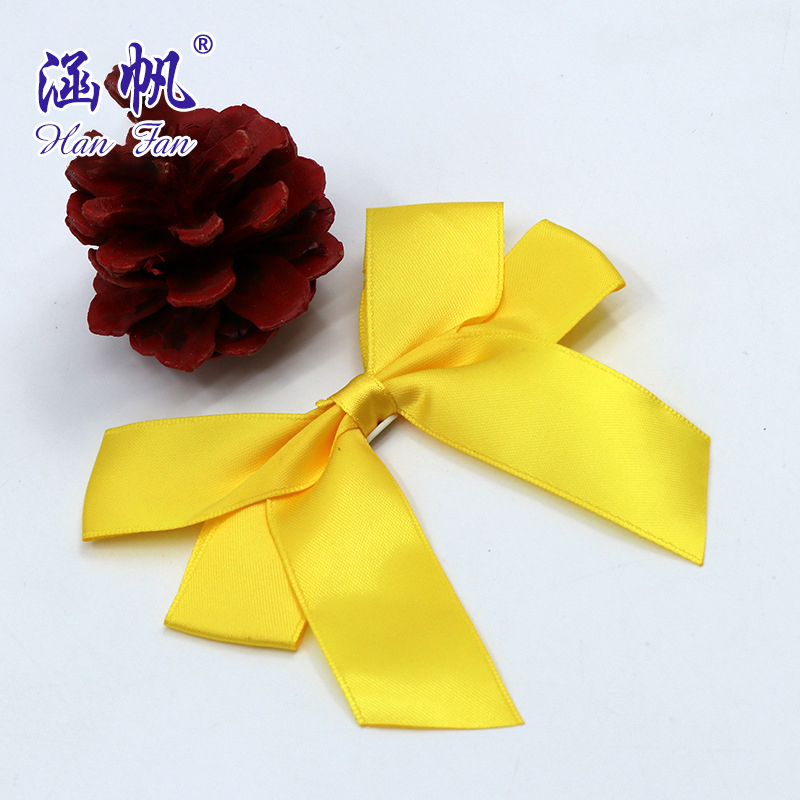 A professional bow manufacturer supplies high-end golden polyester ribbon bows with double-sided tape decoration gift boxes details Picture