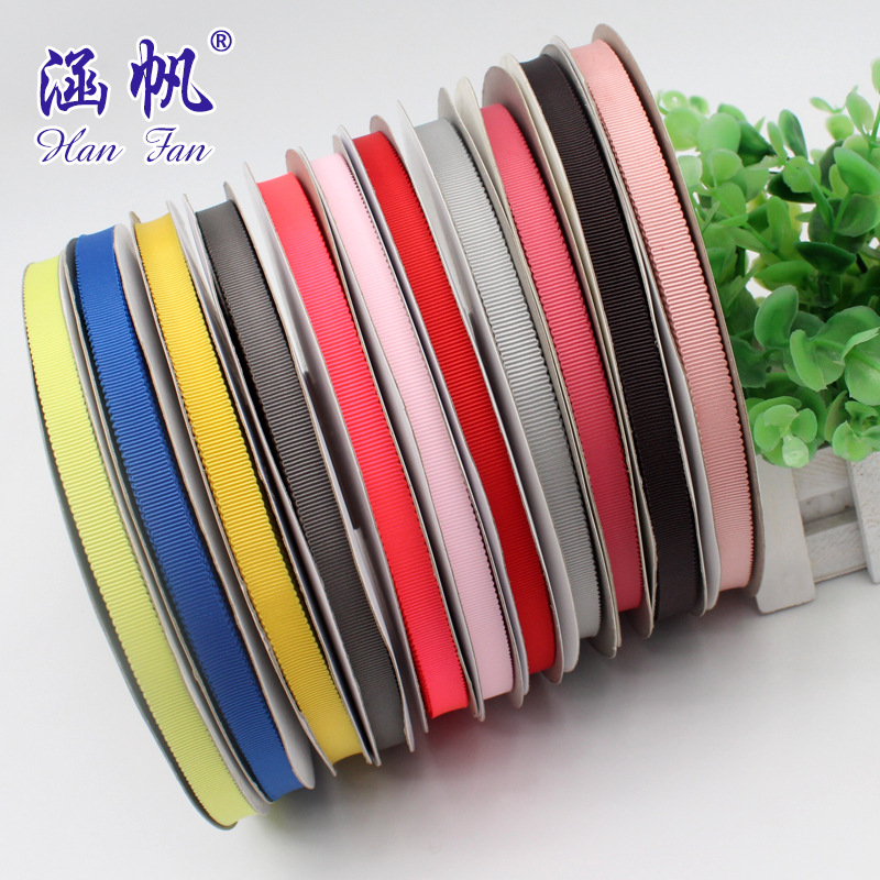 The manufacturer offers a large quantity of 1cm multi-color polyester hat strap with a special discount. The gift box decoration can be made into a solid color woven strap with a bow