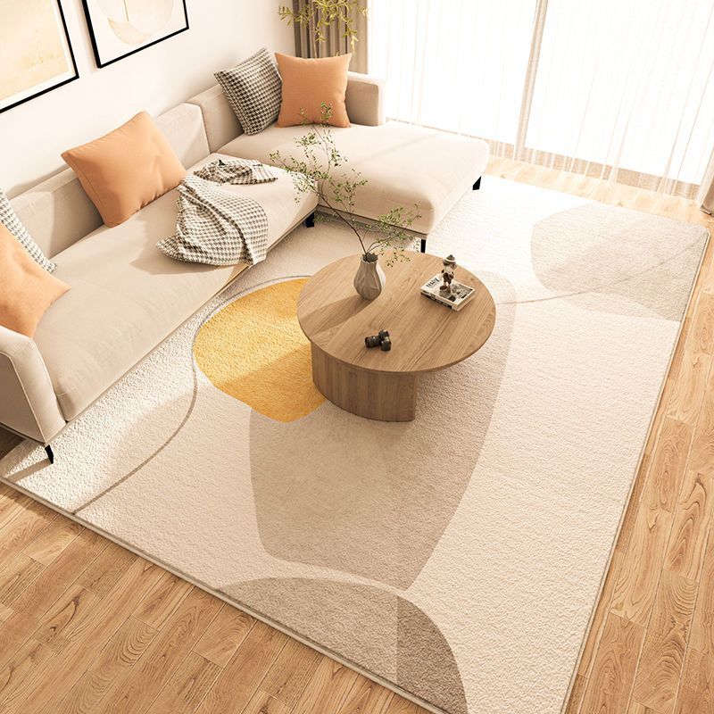 The Nordic minimalist living room features a faux cashmere carpet, home sofa, coffee table and anti-slip carpet. The room is fully carpeted over a large area details Picture
