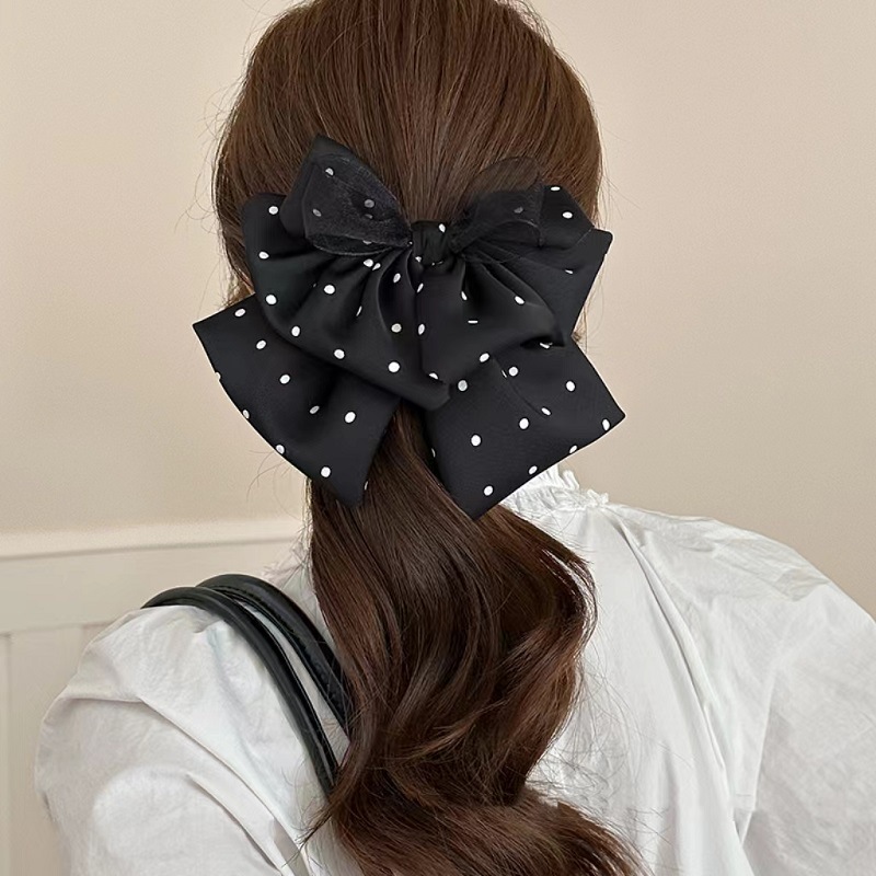 Korean-style polka dot satin bow ponytail clipper with a high-end and elegant look, upside-down hair at the back of the head, shark clip hair accessory details Picture