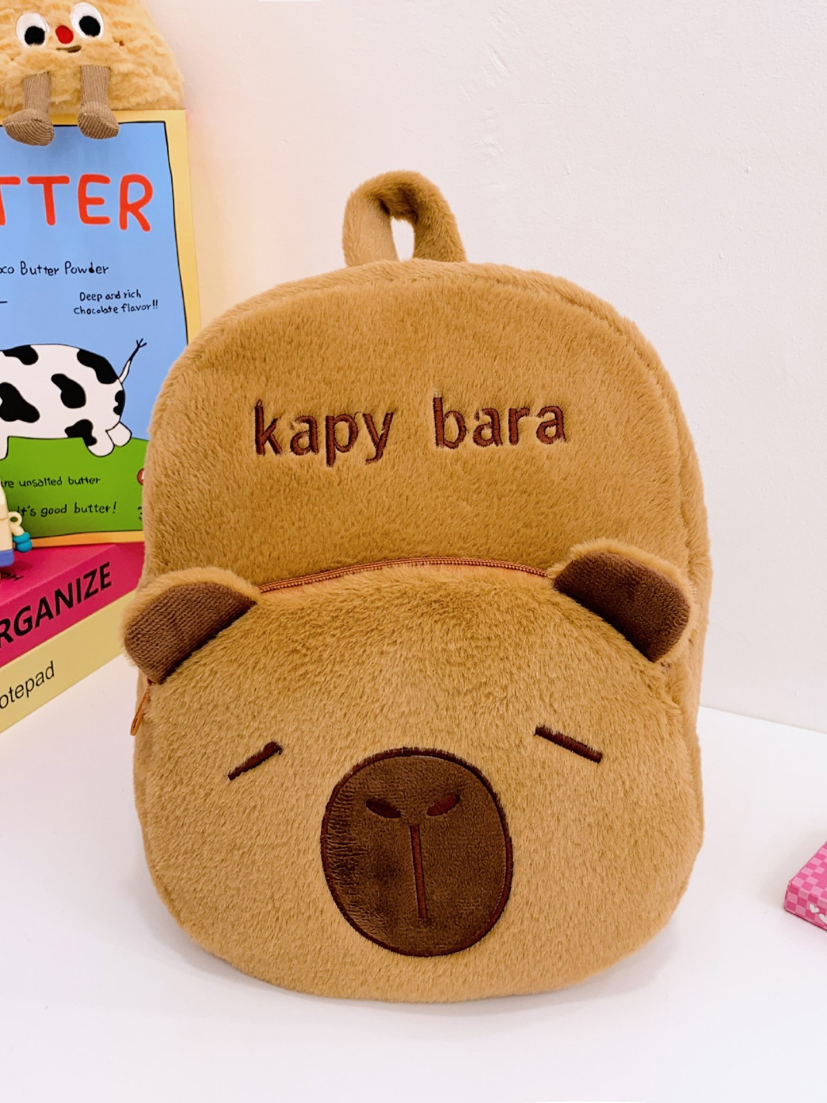 The new Capibara plush capybara is cute and versatile. It features a cartoon student backpack and an export cross-border bag Application Scenario