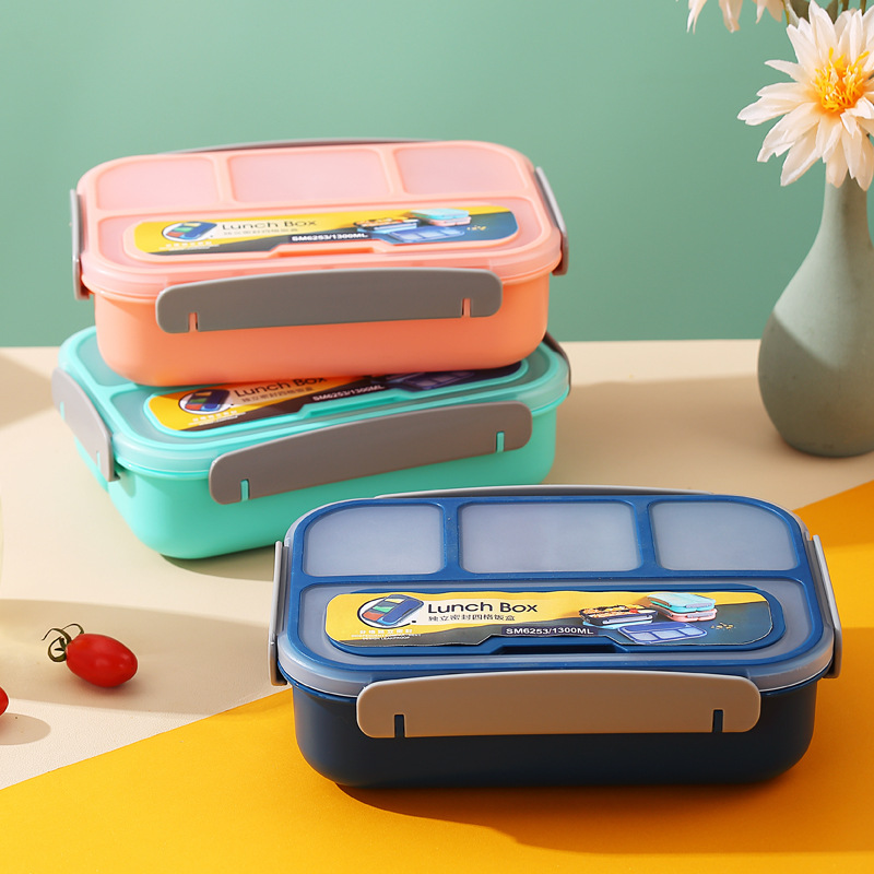 A four-compartment plastic lunch box that can be used in a microwave oven