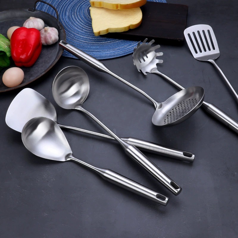 A six-piece set of 304 stainless steel round-handled kitchenware for household and hotel use, including soup spoons, strainers, cooking spoons, spatulas, and steaks