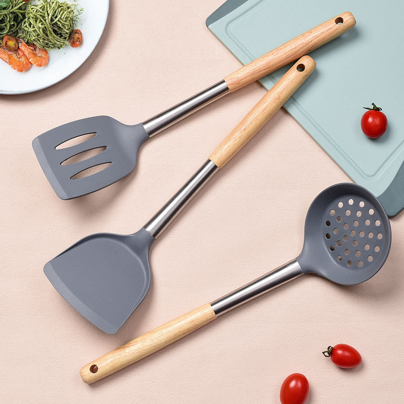 A 4-piece set of large grey wood-handled silicone spatula, a kitchenware set specially designed for non-stick cooking pans with silicone spatula and spoons