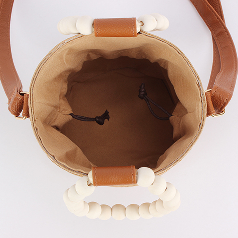 A niche, fashionable and simple straw-woven bag, a cute forest-themed wooden bead hand-carried bucket bag, a versatile beach bag for vacation and travel Specification image