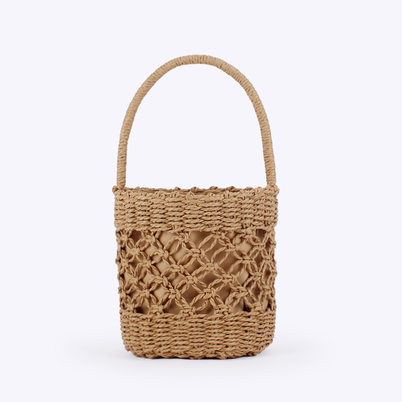 A hand-held bucket woven bag for delivery, a hand-held hollowed-out vacation, photo shoot, casual, versatile, commuting, beach and ladies' bag