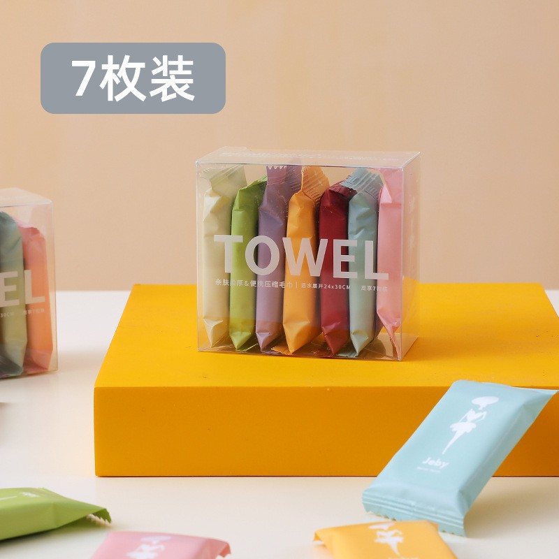 一次性压缩毛巾旅行装批发便携式压缩洗脸巾加厚糖果装小方巾白底实物图