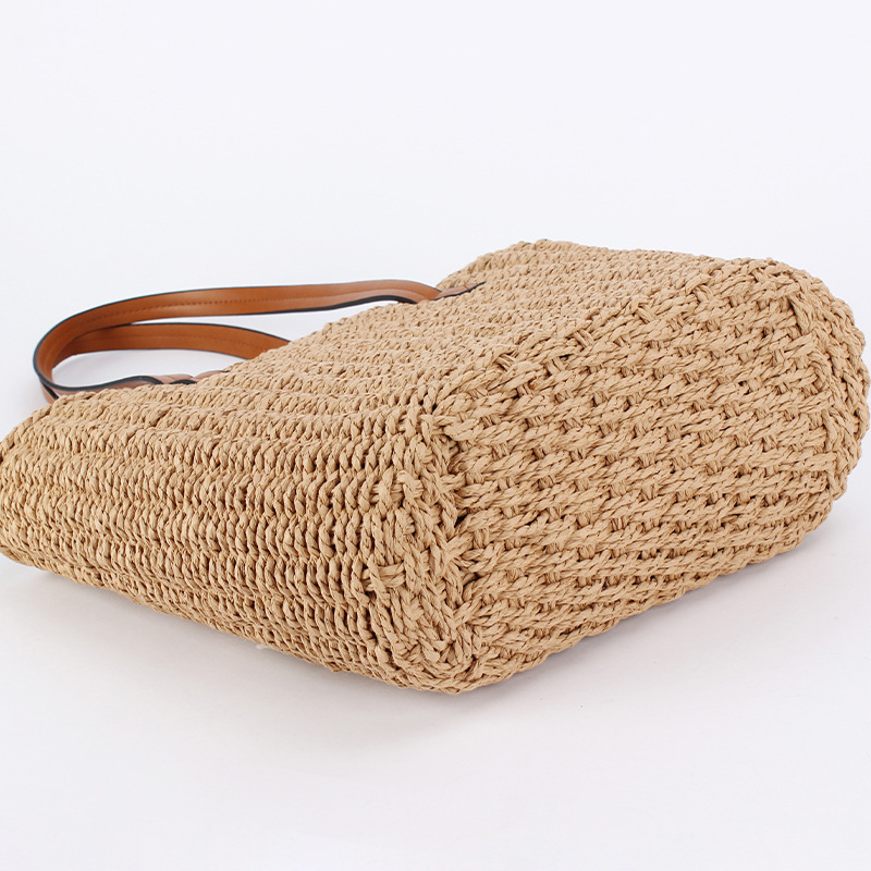 Brown leather hand-held bag with straw weaving, a small crossbody bag with artistic weaving and crocheted silver thread spliced together details Picture