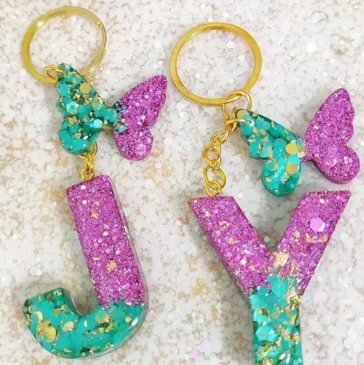 2024 Cross-border in-stock pink sequined resin keychain pendant with 26 English letters and butterfly tassel accessory Specification image