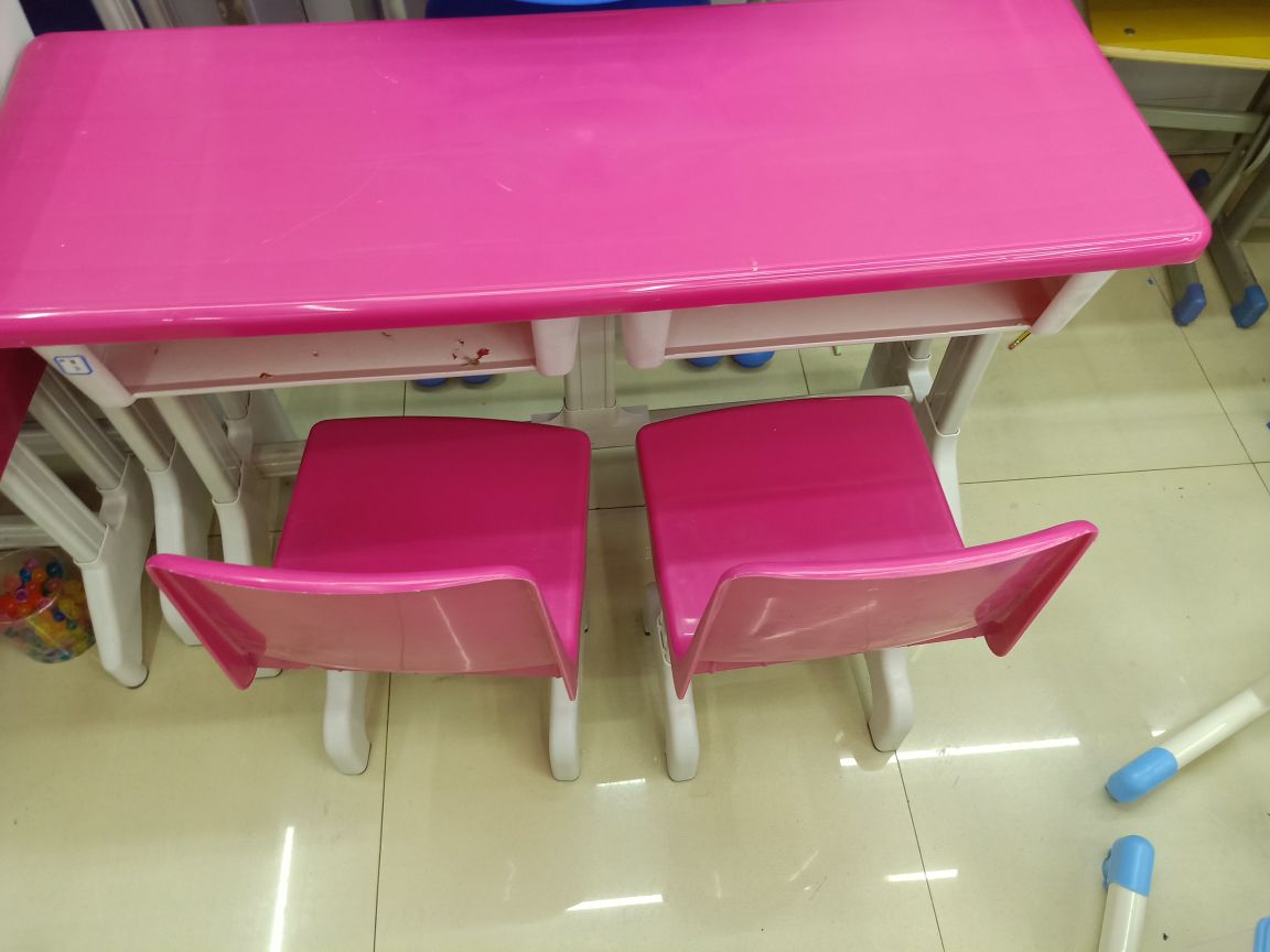 A red double table for toddlers