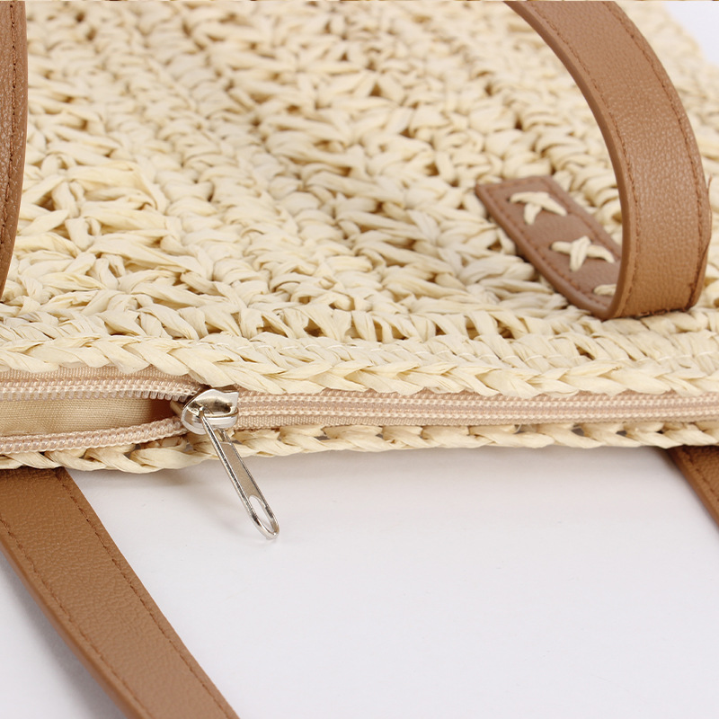 The beige straw woven bag body is paired with a brown leather hand-woven bag. The women's small crossbody bag is crocheted with silver thread details Picture