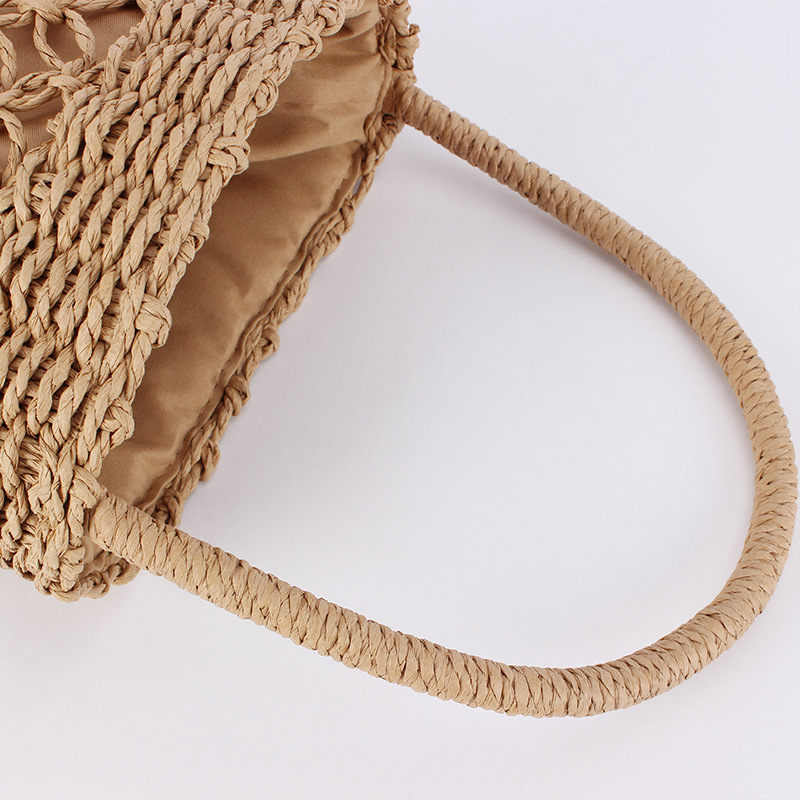 A hand-held bucket woven bag for delivery, a hand-held hollowed-out vacation, photo shoot, casual, versatile, commuting, beach and ladies' bag Item Picture