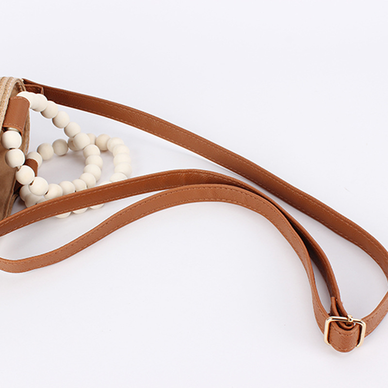 A niche, fashionable and simple straw-woven bag, a cute forest-themed wooden bead hand-carried bucket bag, a versatile beach bag for vacation and travel Item Picture