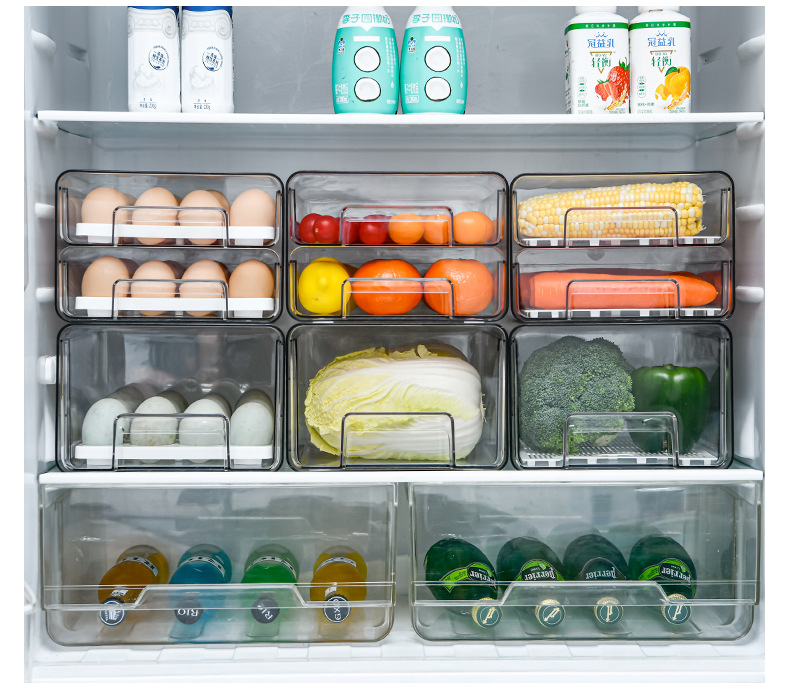 The manufacturer customizes a drawer type PET multi-functional refrigerator storage box that can be stacked for storing fruits, vegetables, draining water and eggs