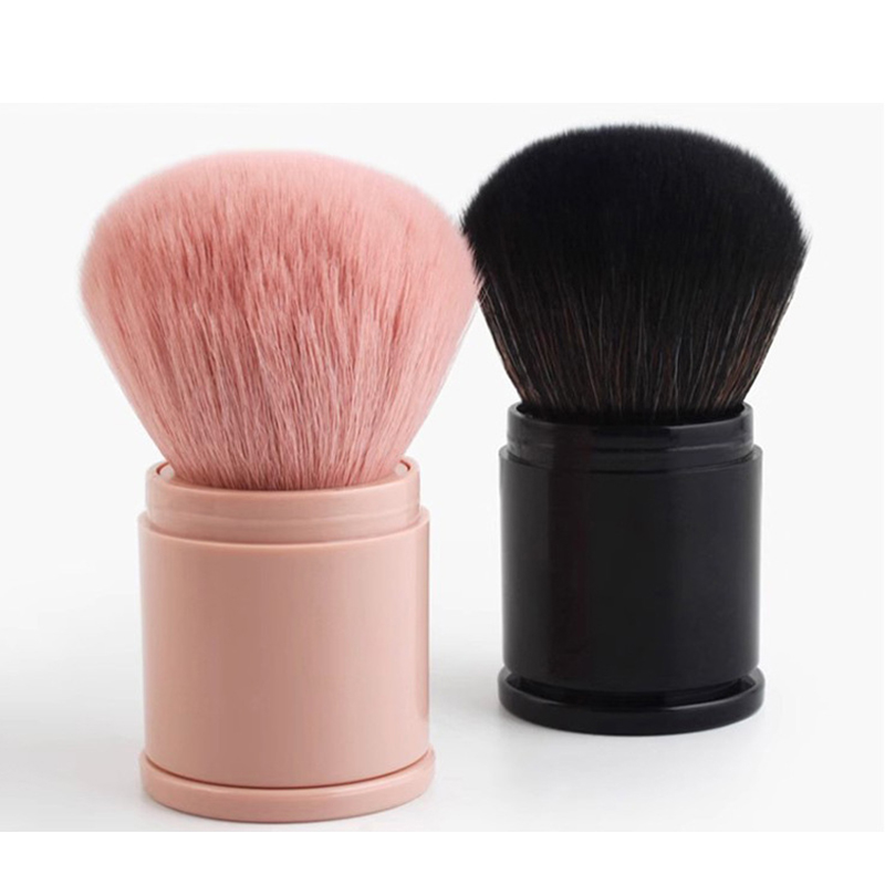 The soft bristles of the covered brush gently apply it, suitable for facial blush and loose powder