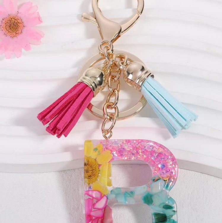 2024 Cross-border in-stock pink sequined resin keychain pendant with 26 English letters and butterfly tassel accessory Application Scenario