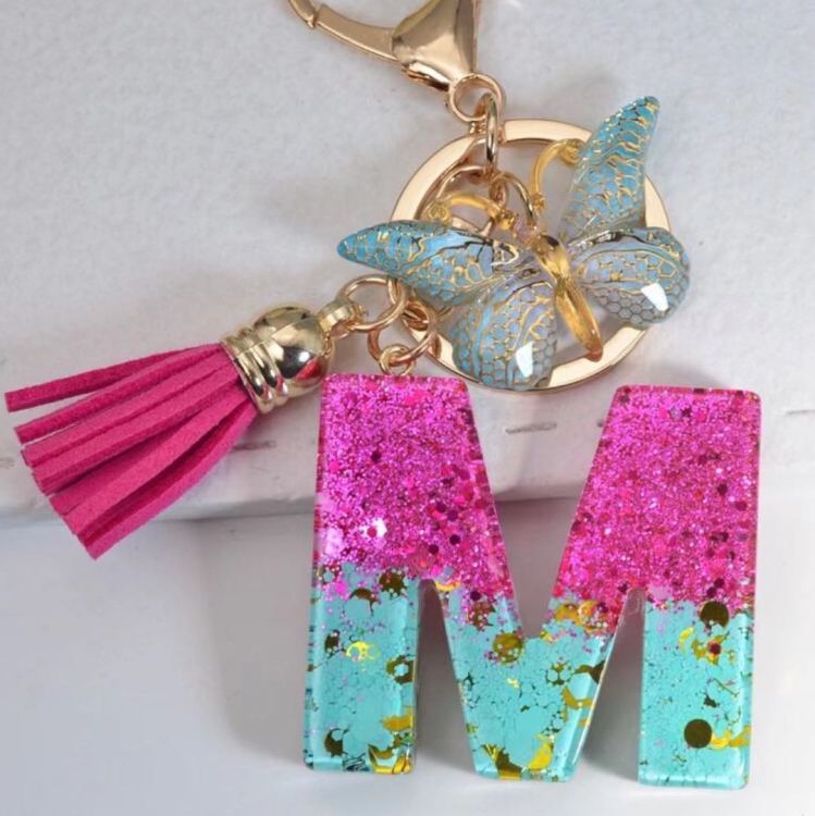 2024 Cross-border in-stock pink sequined resin keychain pendant with 26 English letters and butterfly tassel accessory Item Picture