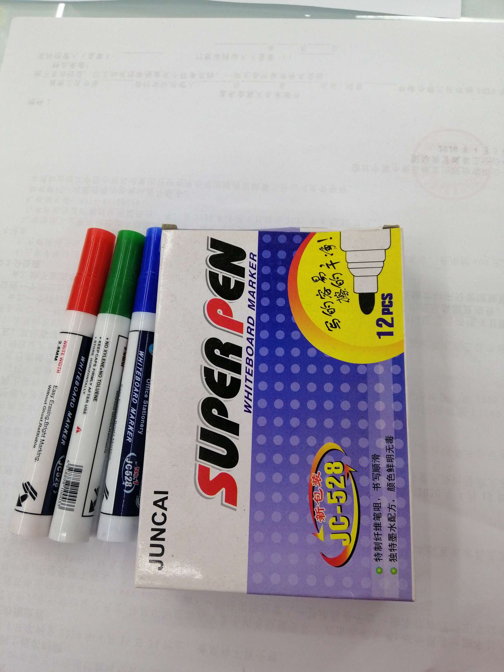 Twelve small boxes contain whiteboard pens details Picture
