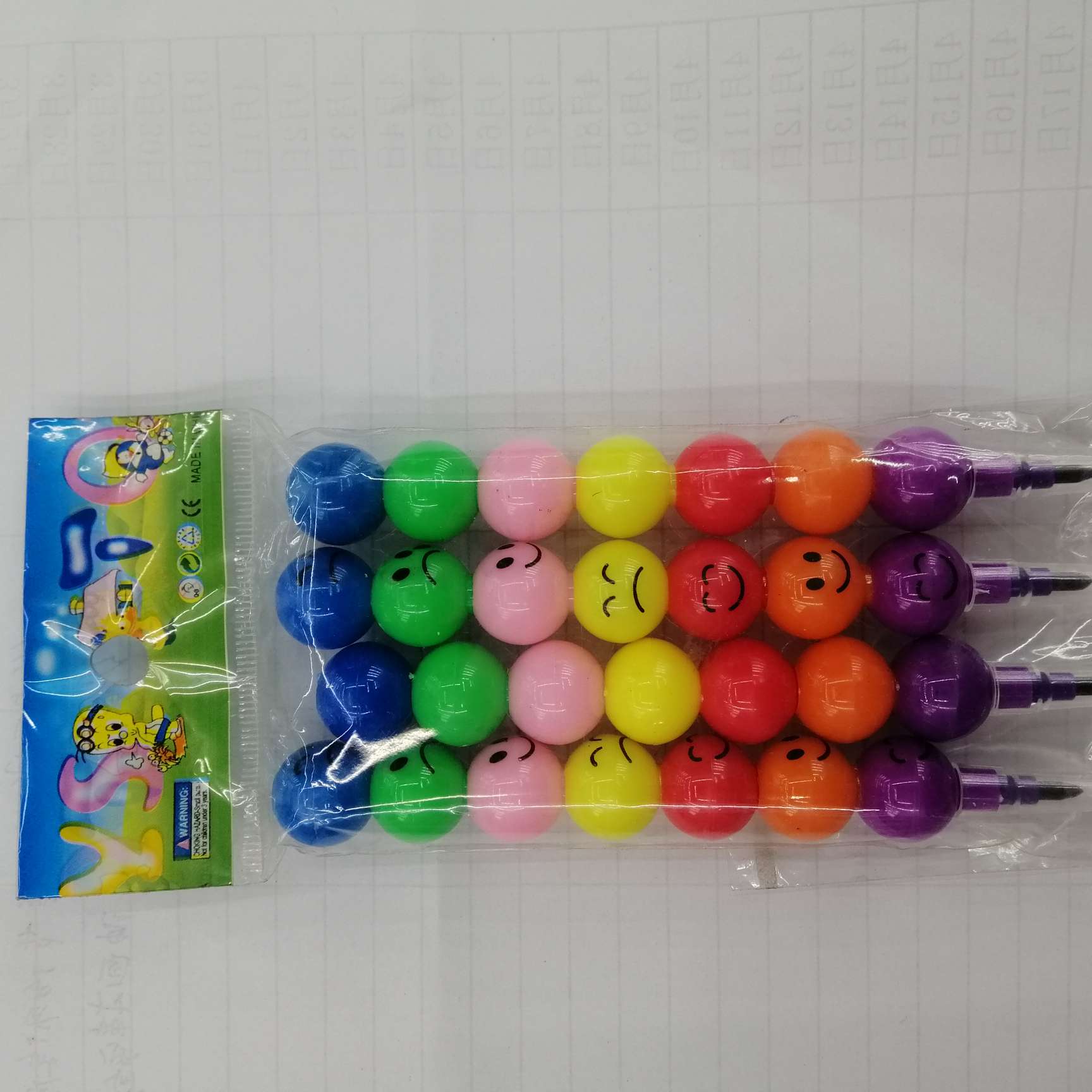 Seven smiling face pens and pencils full figure