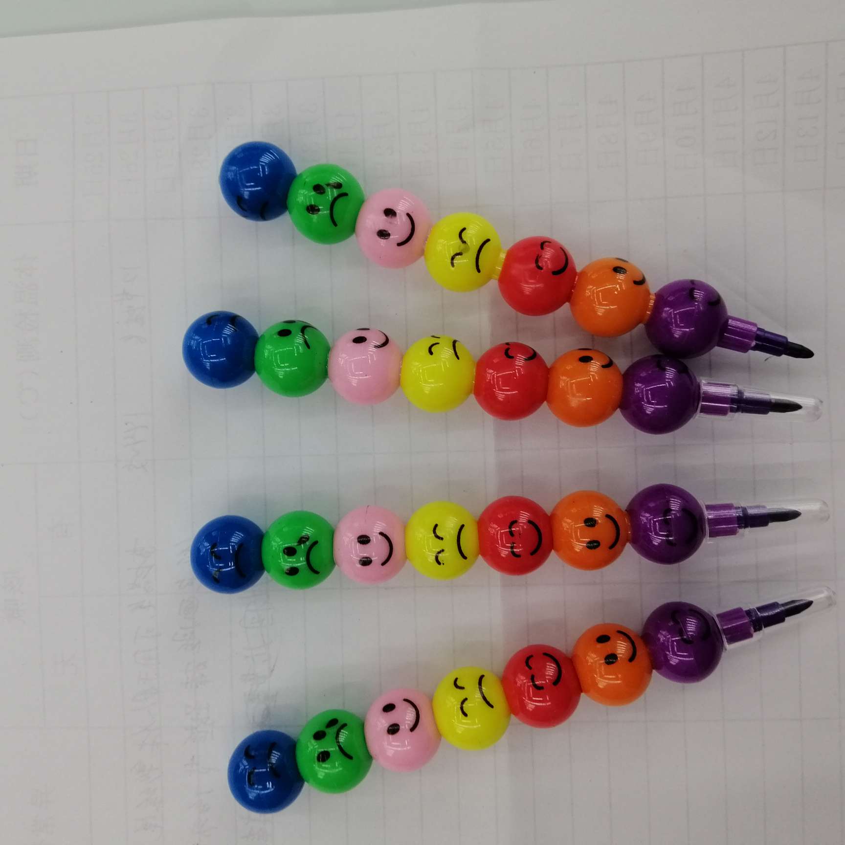 Seven smiling face pens and pencils details Picture