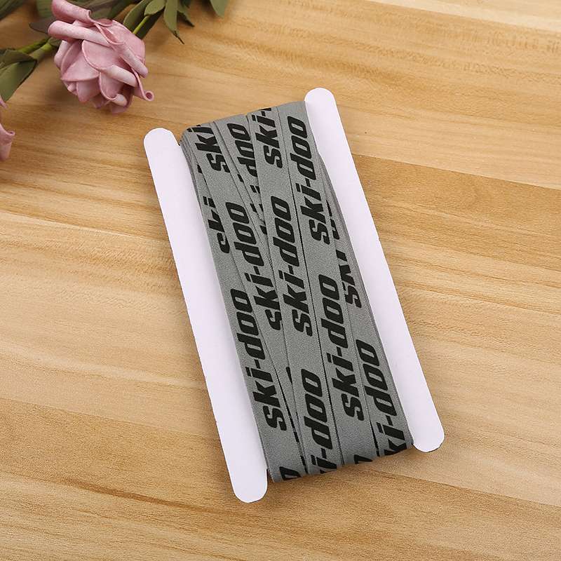 Packaging card with elastic tape wrapped around product