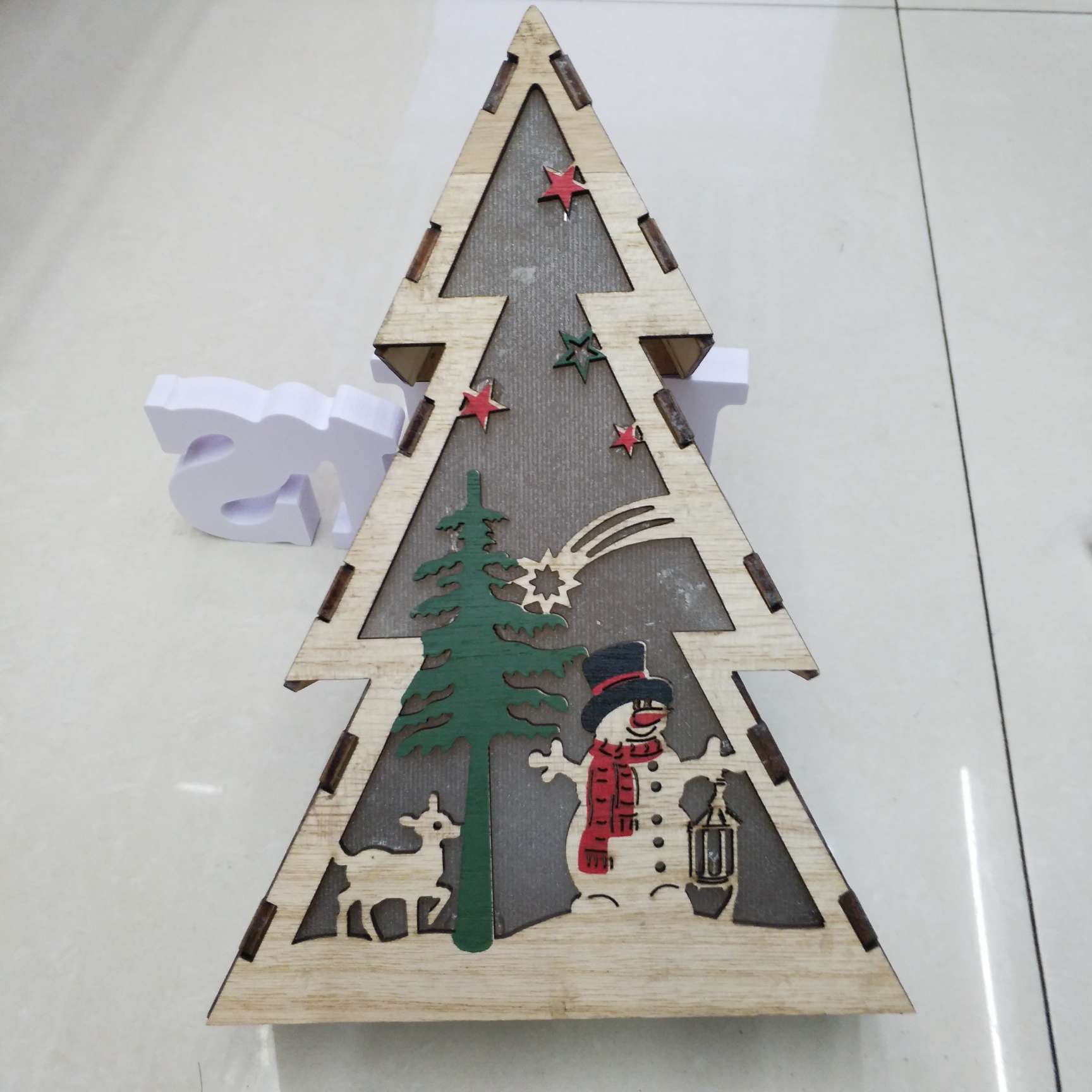 Wooden Christmas ornaments with lights, five-pointed stars, houses and lighthouses Application Scenario