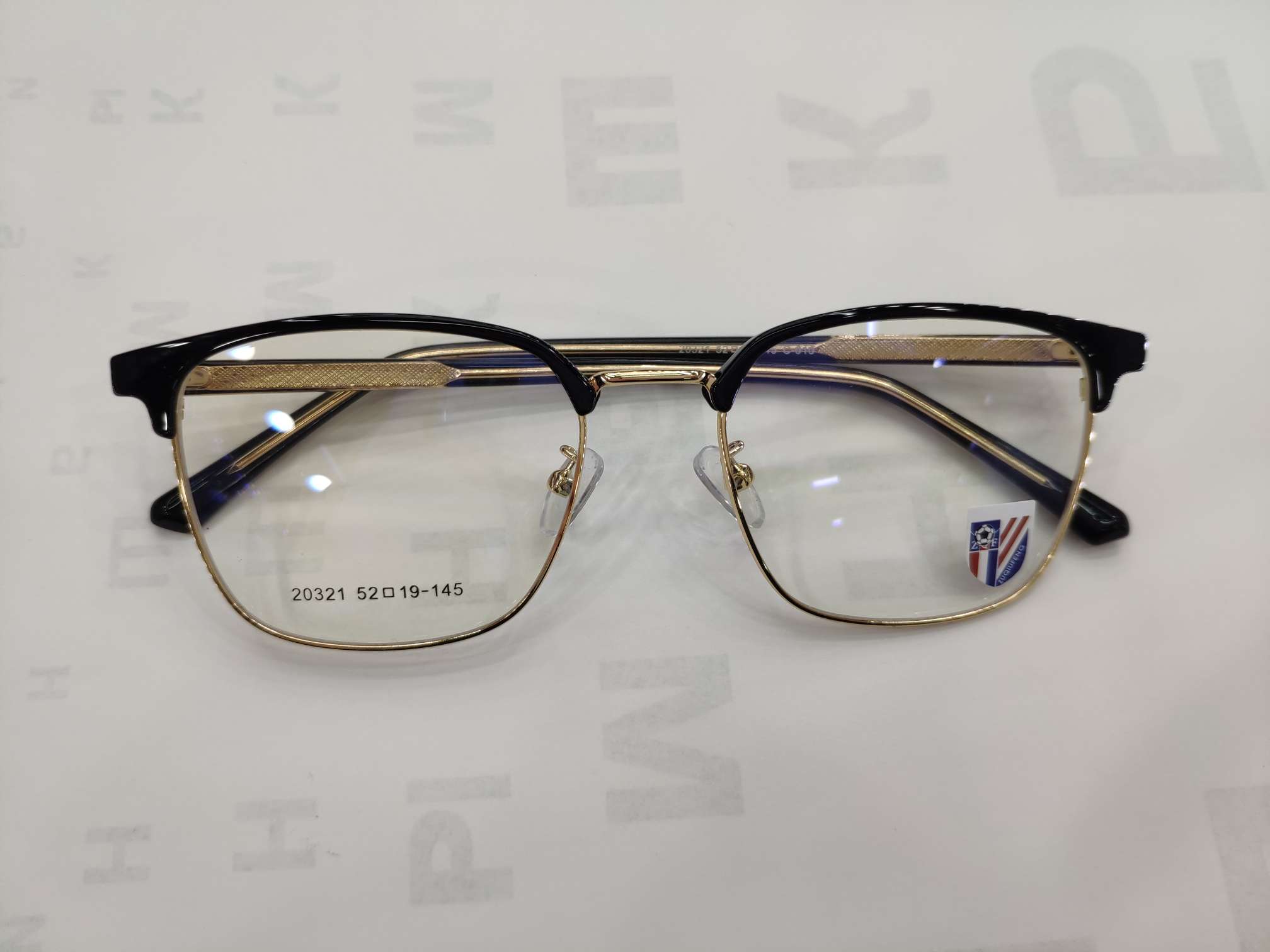 Square-framed black gold-rimmed spectacle frame details Picture