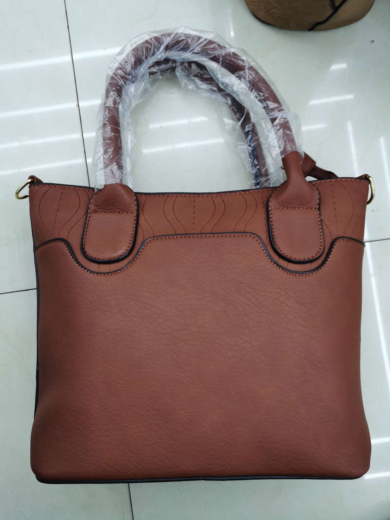 The lady's handbag has a large capacity