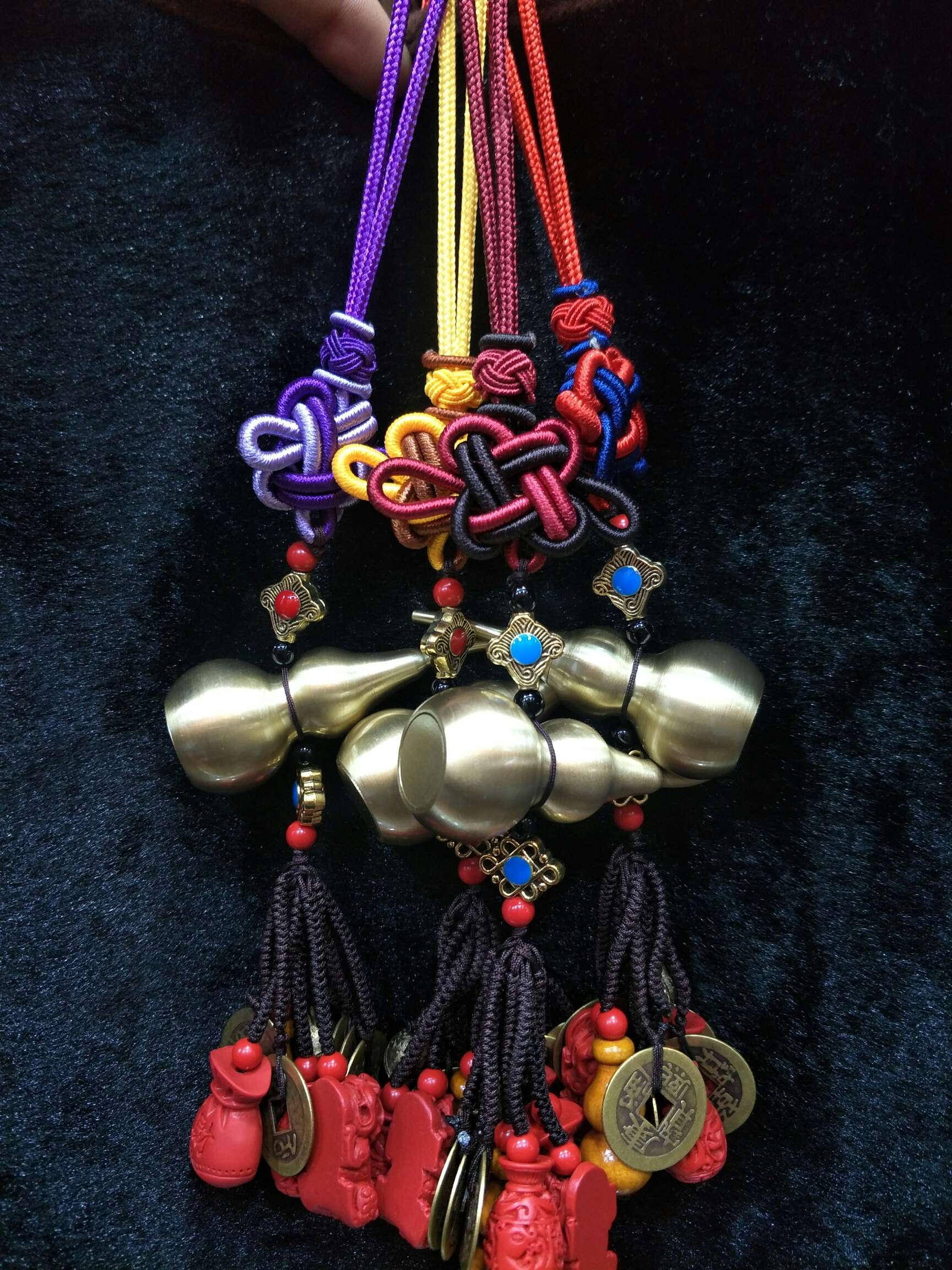 A copper gourd cart is hung with Five Emperors' coins and cinnabar details Picture