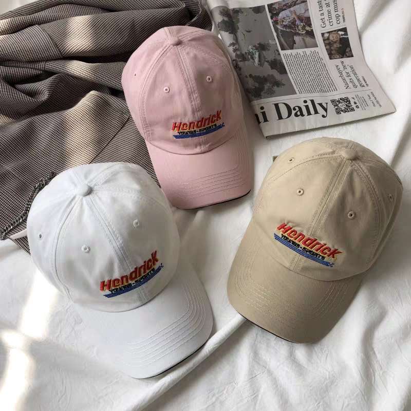 A few clips of models strolling through city streets and quiet beaches in various costumes and wearing complementary American baseball caps on their heads