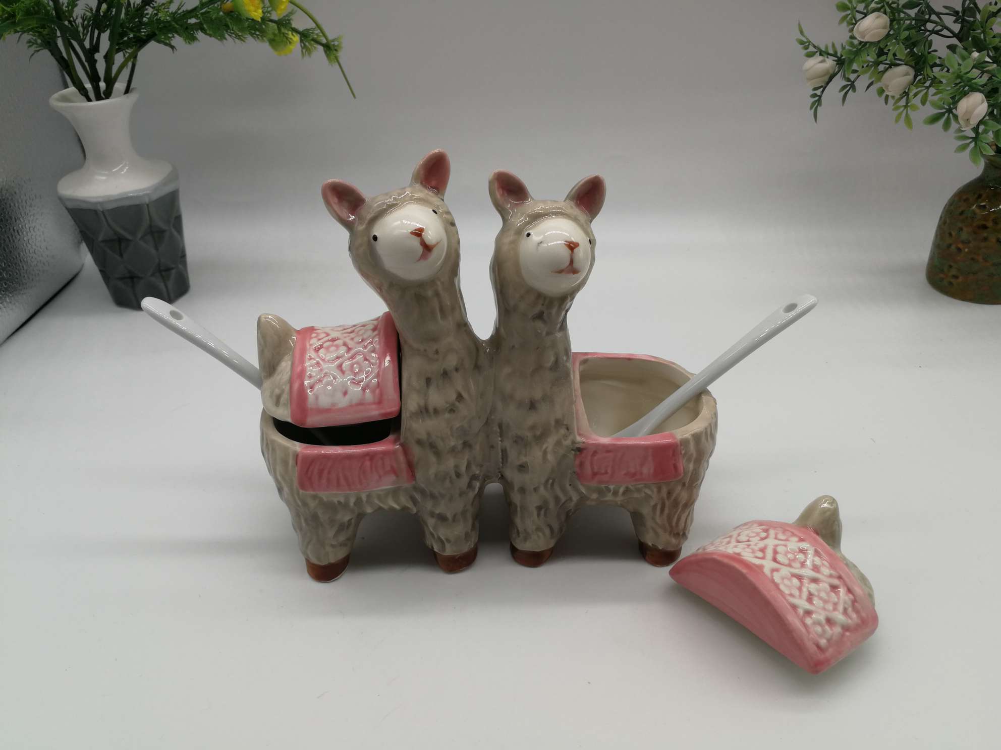 A family of little lambs in a ceramic jar undefined