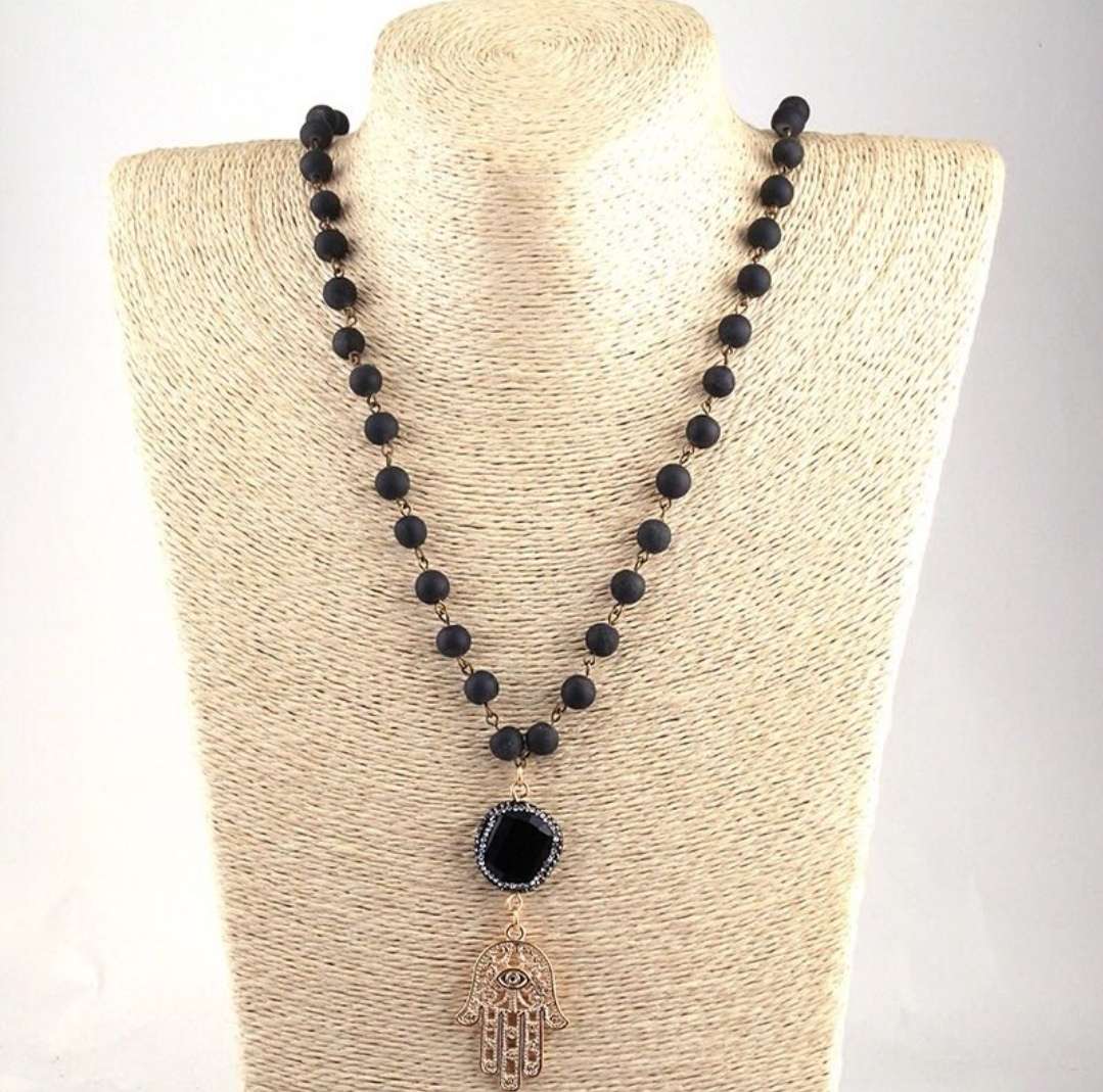 A long knotted teardrop crystal pendant necklace for women Item Picture
