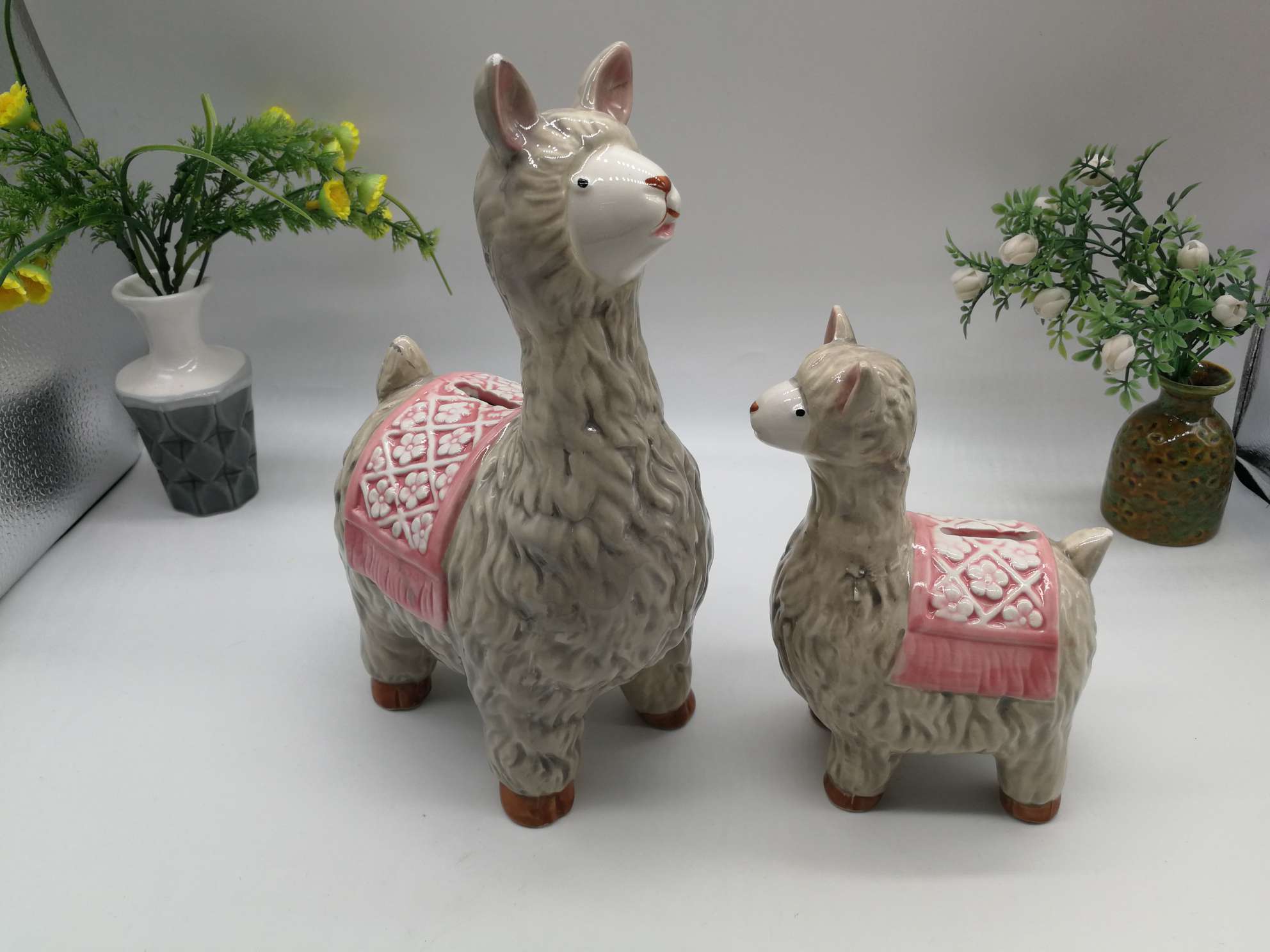 A family of little lambs in a ceramic jar undefined