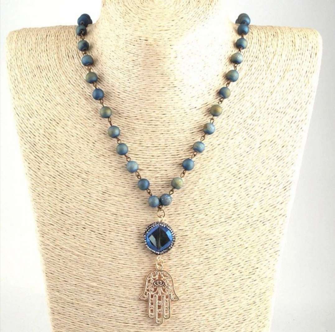 A long knotted teardrop crystal pendant necklace for women