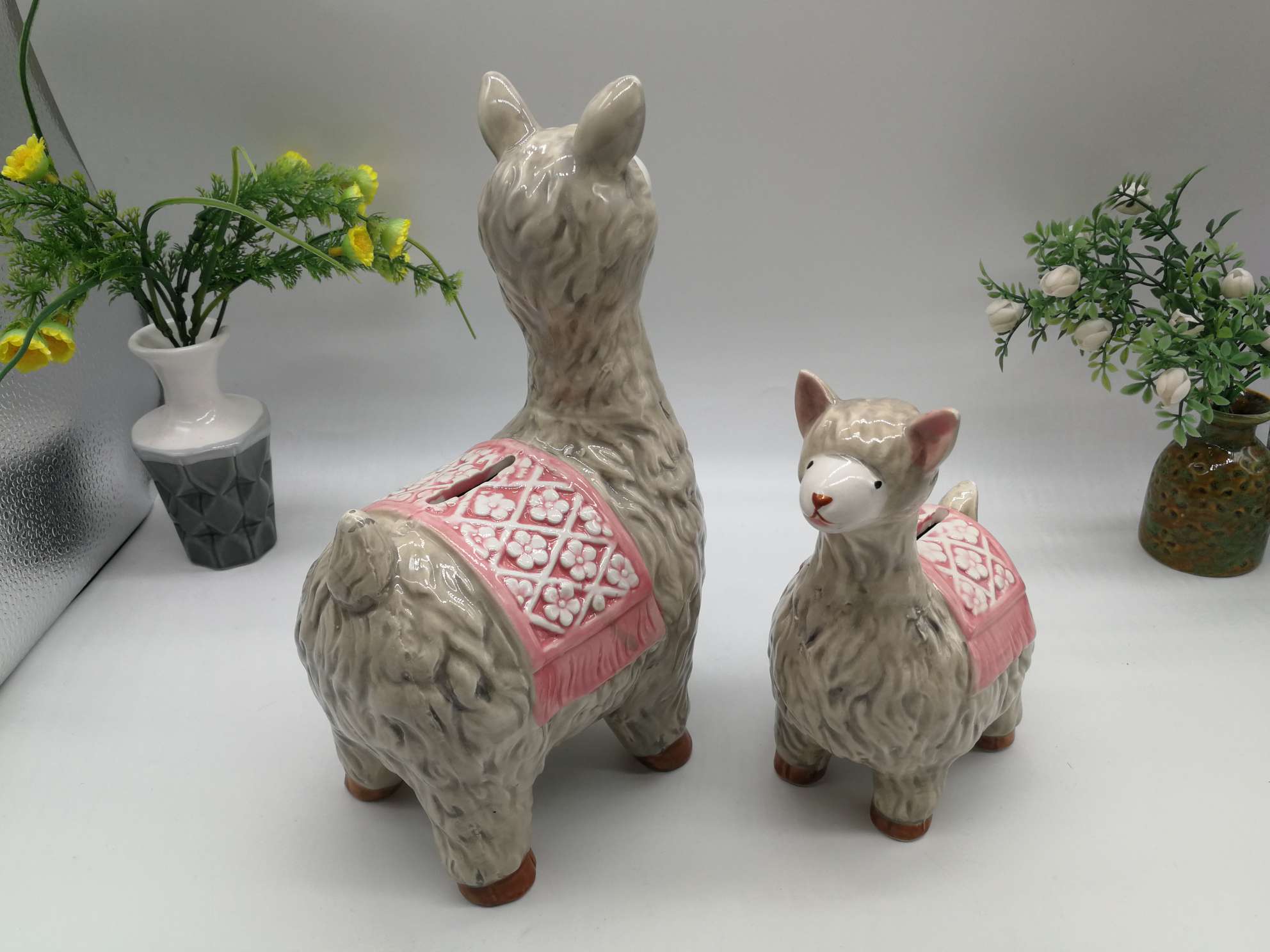 A family of little lambs in a ceramic jar undefined