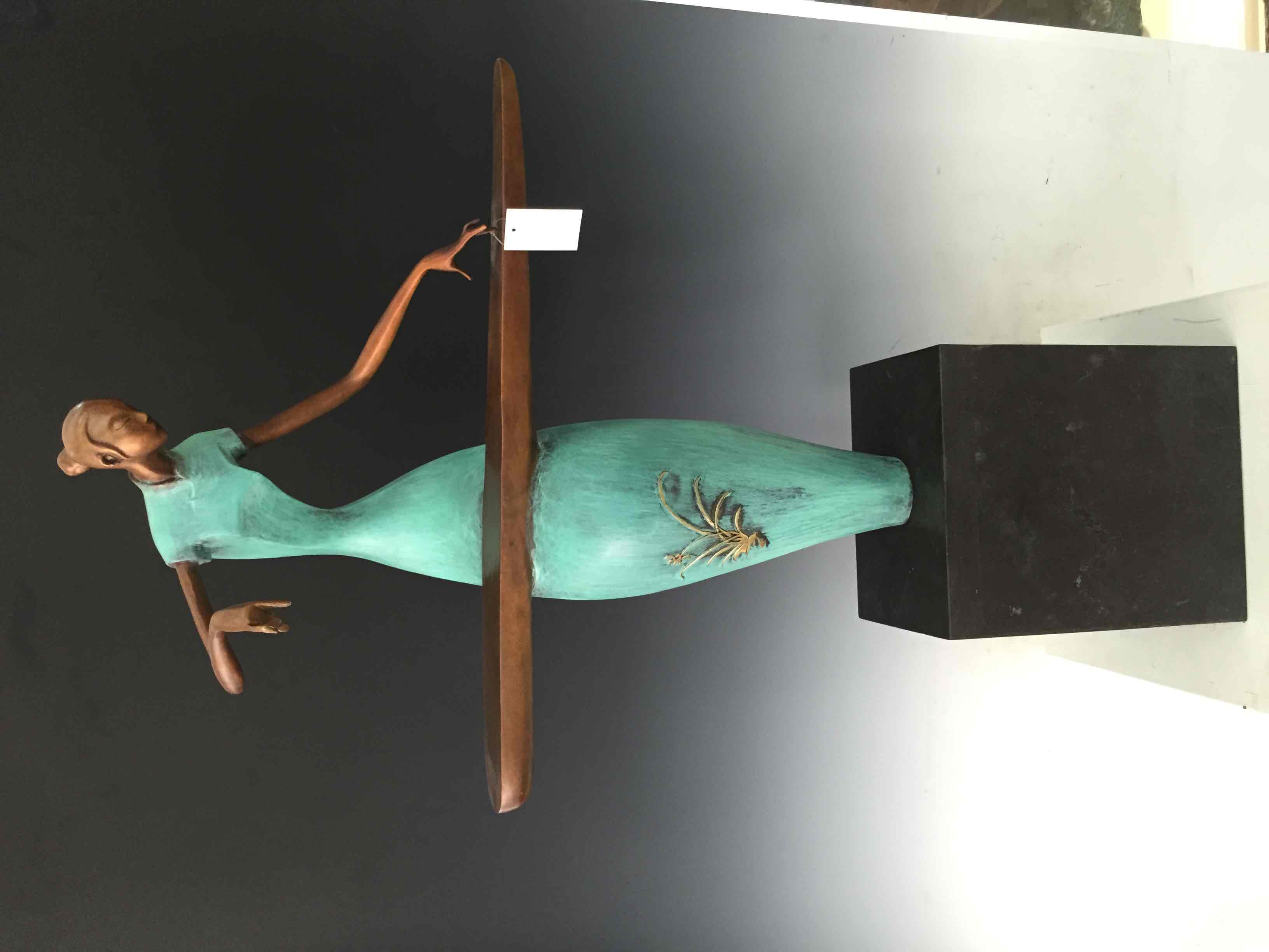 A lady playing the zither with copper carvings and colored copper