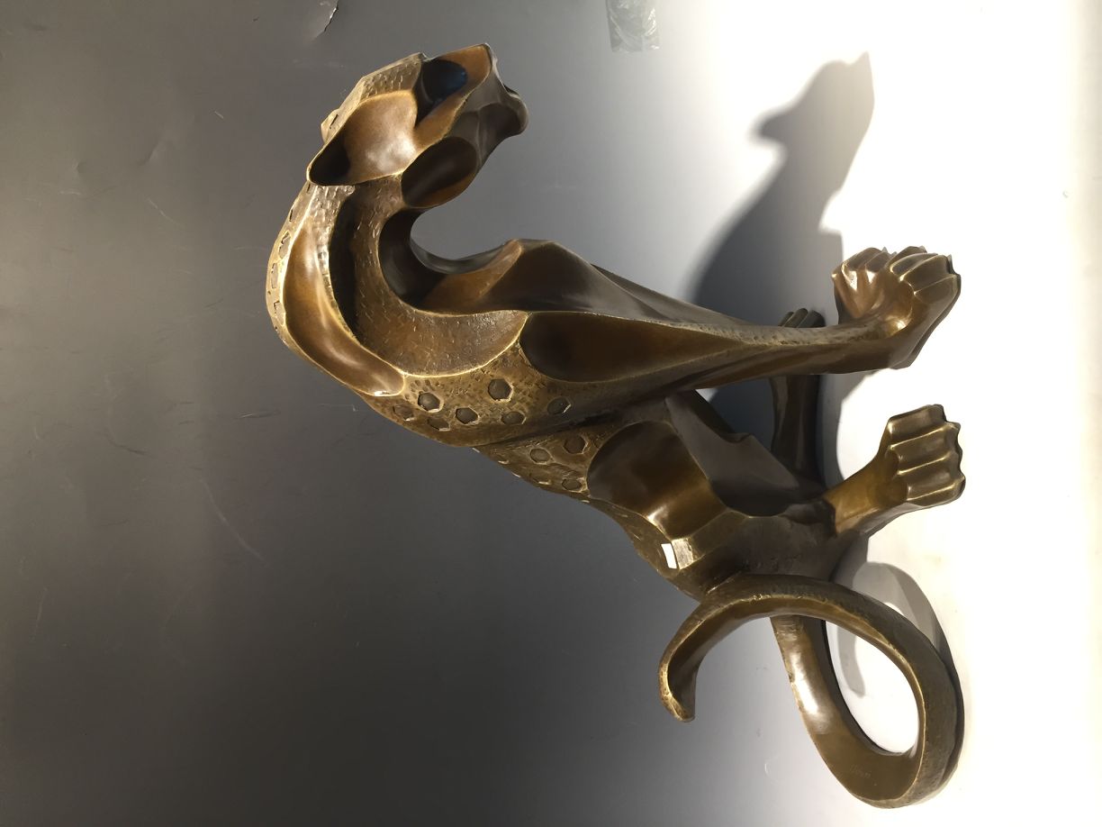 Copper sculpture of brass leopard