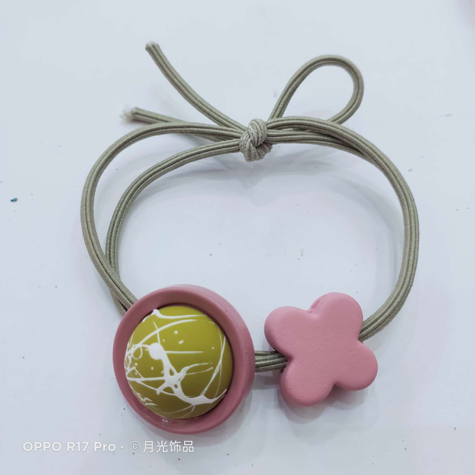 Korean-style trendy brushed button, four-leaf clover, rubber effect, knotted leather band, hair band and leather case details Picture